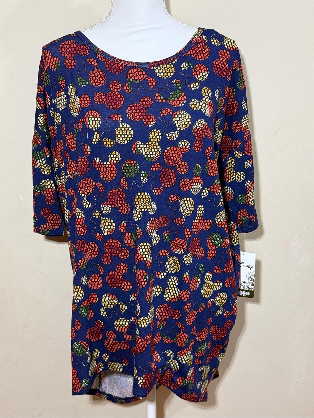 LuLaRoe Disney Irma Blue Tunic with Red, Cream & Green Pattern